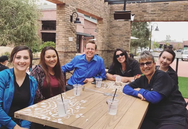 The Brace Connection team together at a table